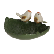 Ceramic leaf shaped bird bath with birds