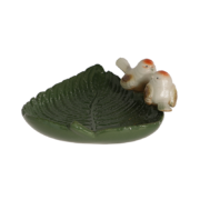 Ceramic leaf shaped bird bath with birds