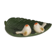 Ceramic leaf shaped bird bath with birds