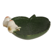 Ceramic leaf shaped bird bath with birds
