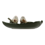Ceramic leaf shaped bird bath with birds