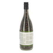 Bouteille de vin remplie de graines de tournesol noires
